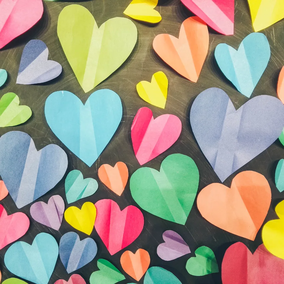 A heart symbol filled with icons representing North Atlanta’s lifestyle — sports, parks, schools, dining, shopping, and community spirit — capturing why locals love the area.