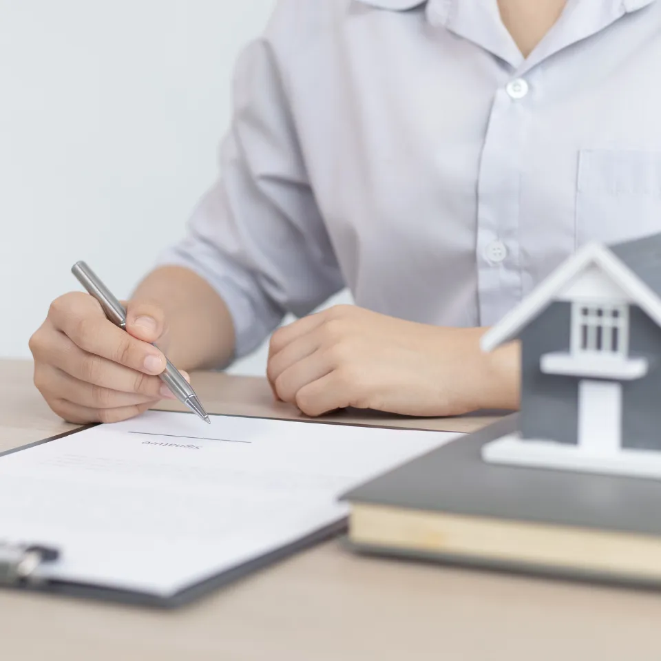Homebuyer reviewing house listings with icons for price, location, and features.