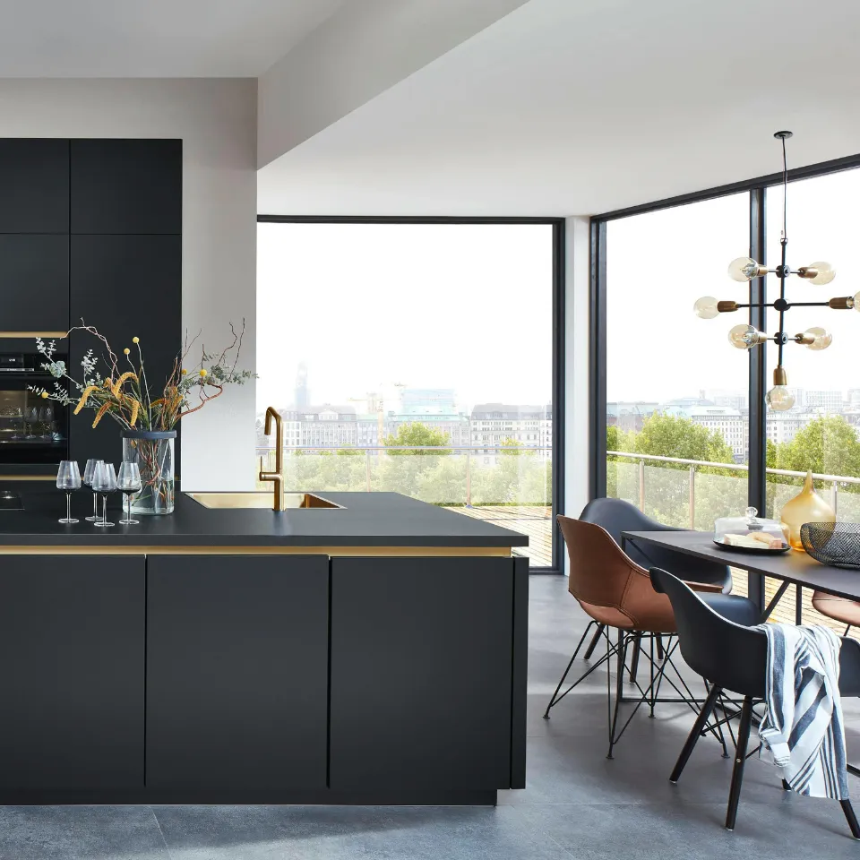 Modern home with natural light, outdoor space, and a kitchen island highlighted.