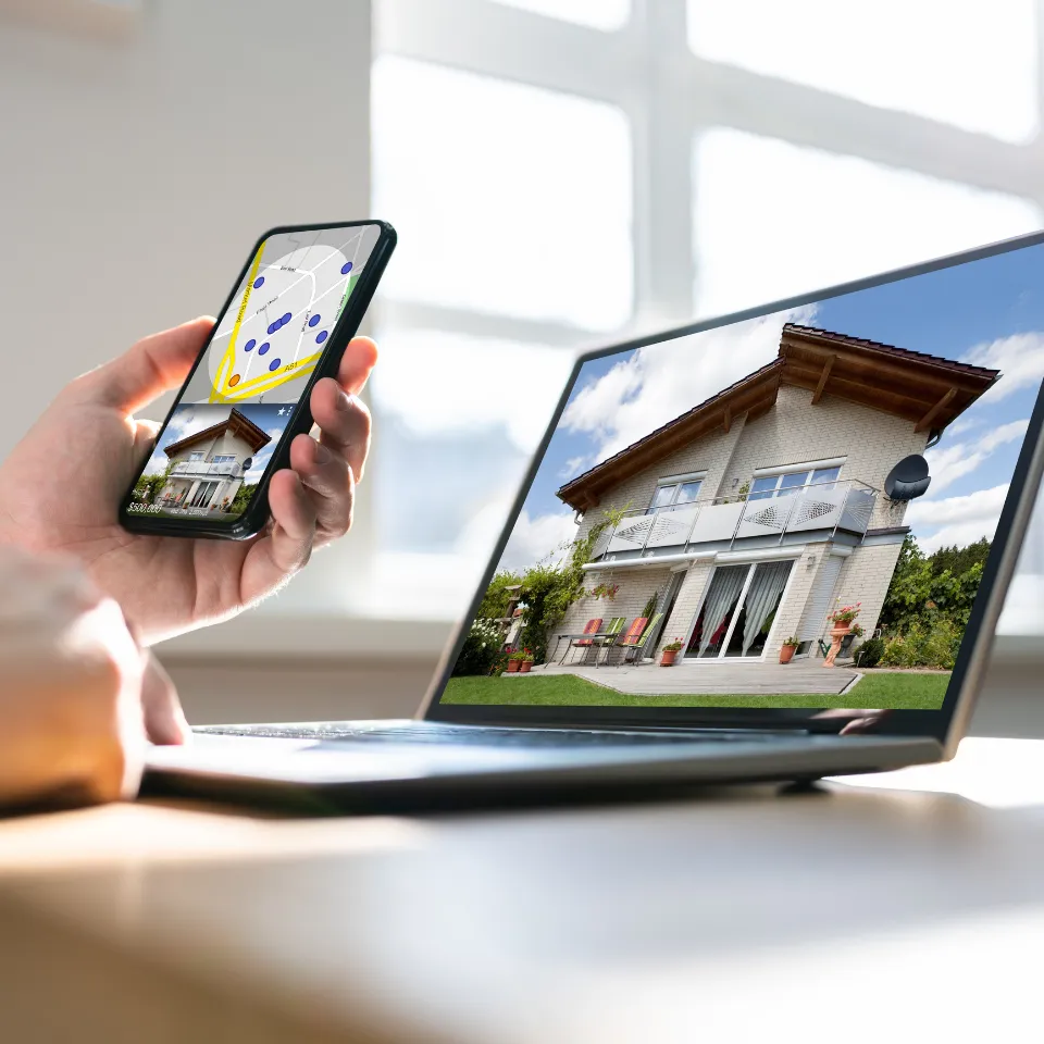 Home buyer using a laptop to take a virtual tour of a house, exploring property features online