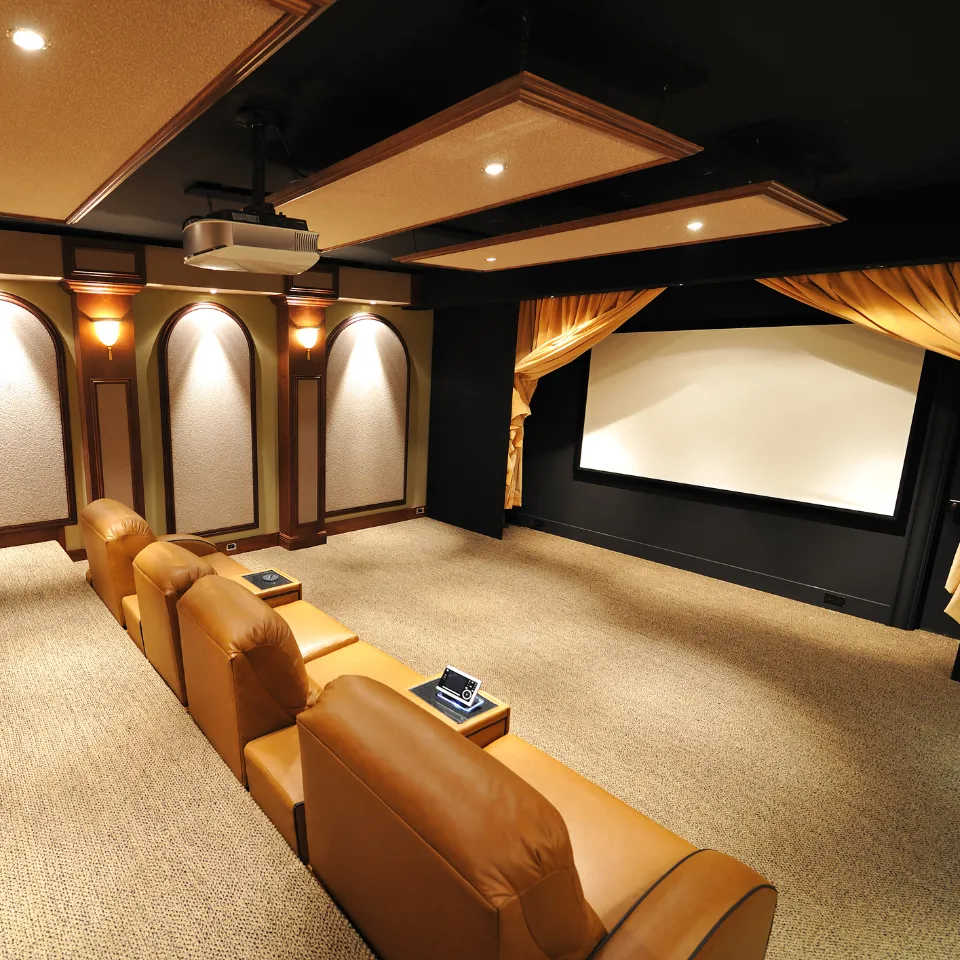Luxury home theater with custom seating, ambient lighting, and large screen, showcasing advanced audiovisual upgrades.
