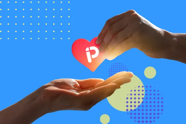 One hand passing a red heart with the Proimpact Project logo to another open hand, symbolizing giving and support, on a bright blue background with geometric design accents.