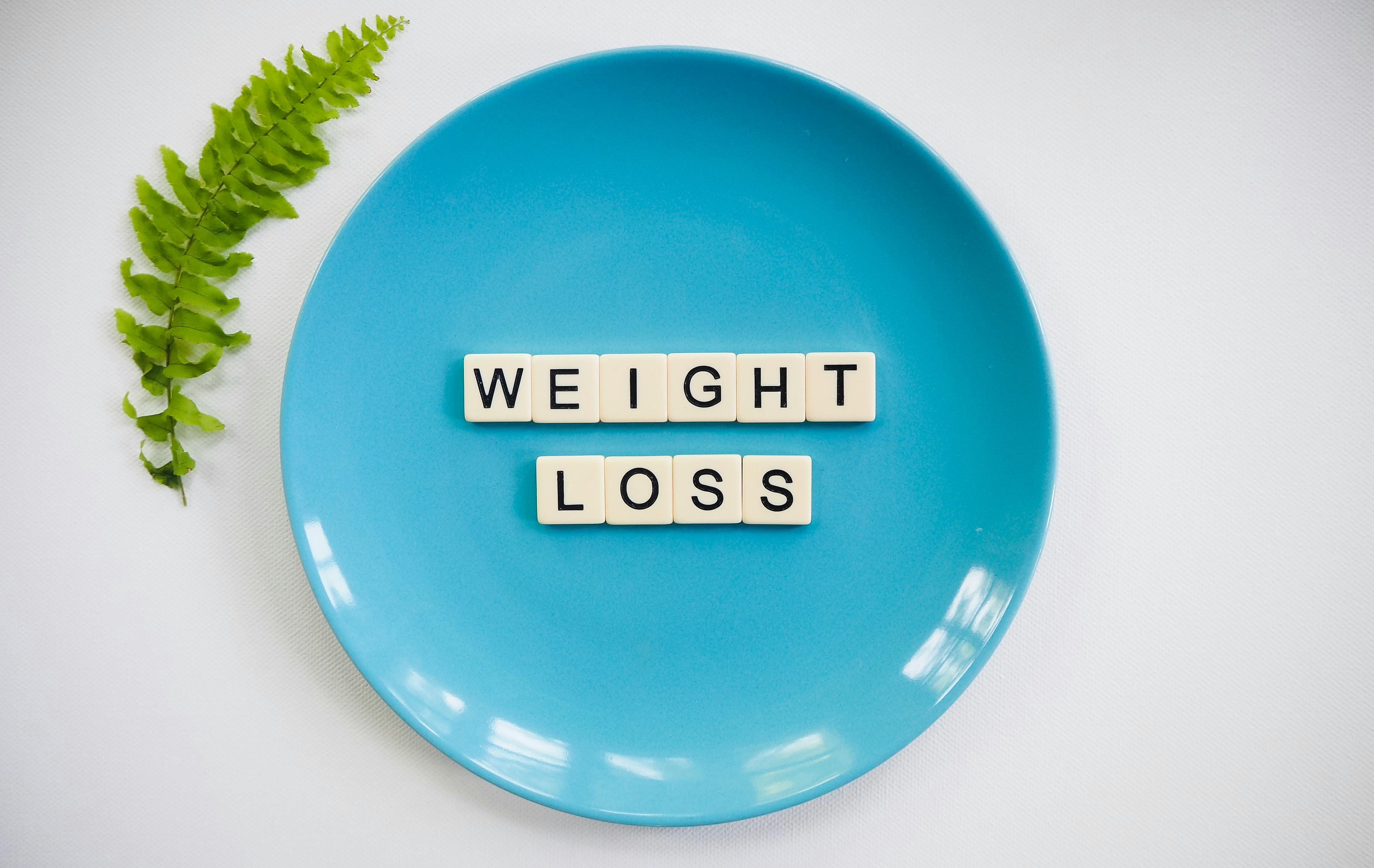Weighloss words on a blue plate