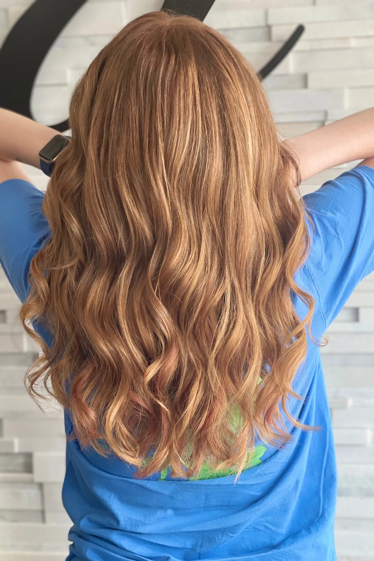 Back view of a density-focused I-Tip hair extension installation with seamless blending in Lancaster PA