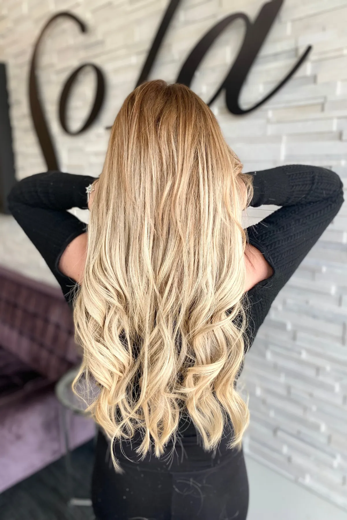 Blonde hair extensions installed using keratin tips for added length and fullness at a Lancaster PA studio