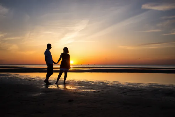 A couple walking on the beach