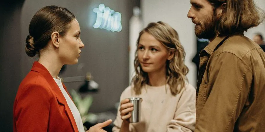 A church leader talking to two of her team members.