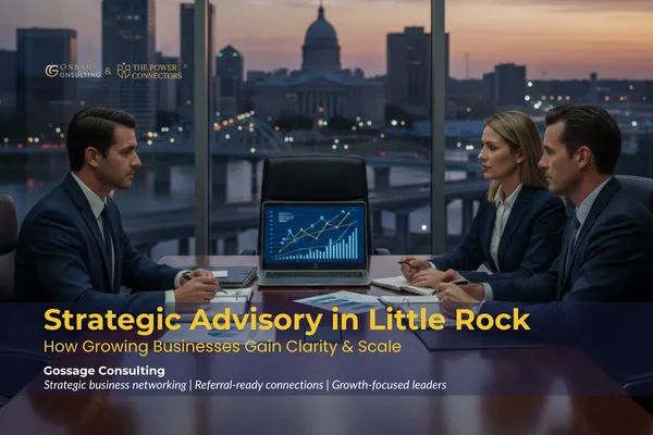 Business leaders reviewing strategy documents during a strategic advisory meeting in Little Rock