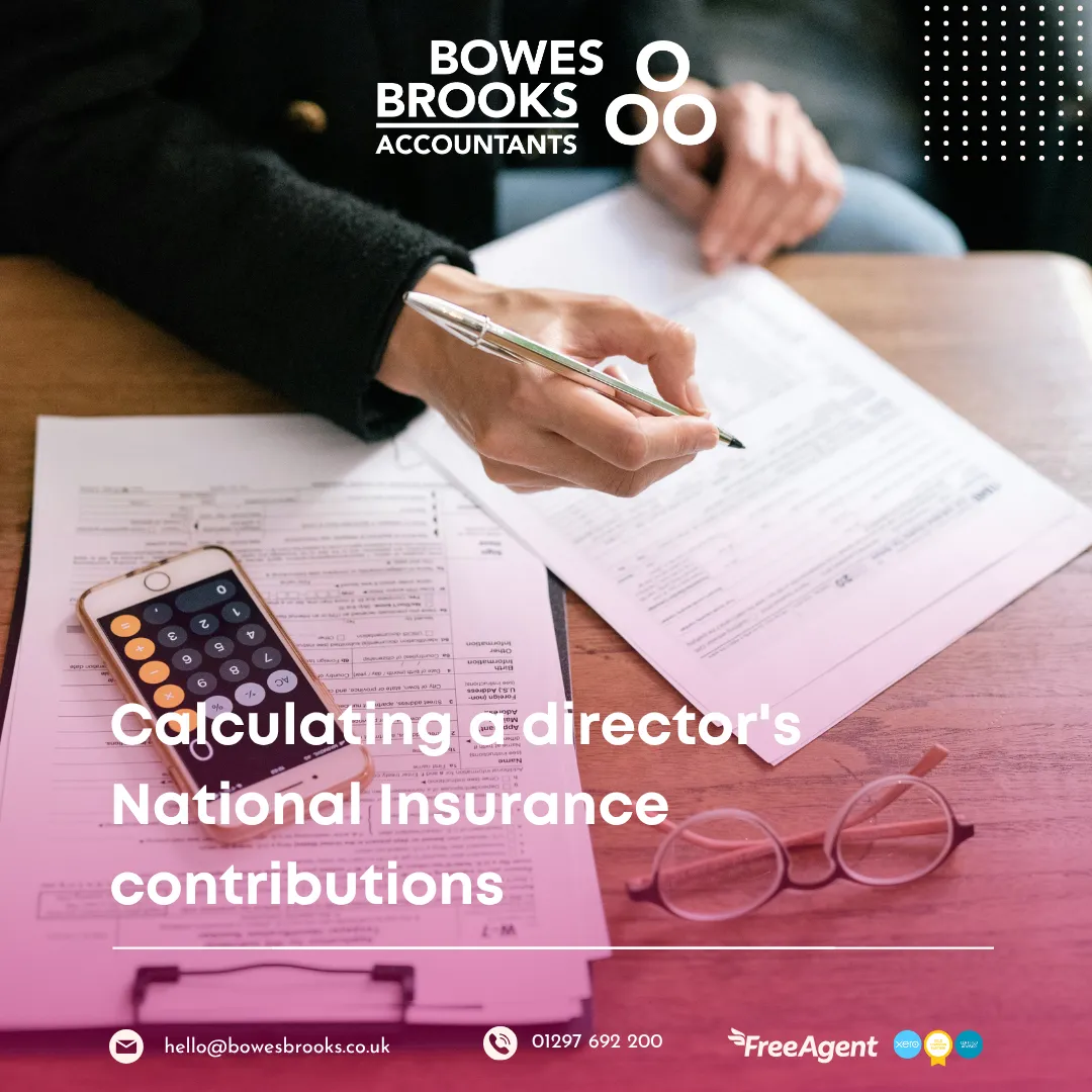 A business director reviewing payroll documents with a calculator, illustrating NIC calculations and tax planning decisions.