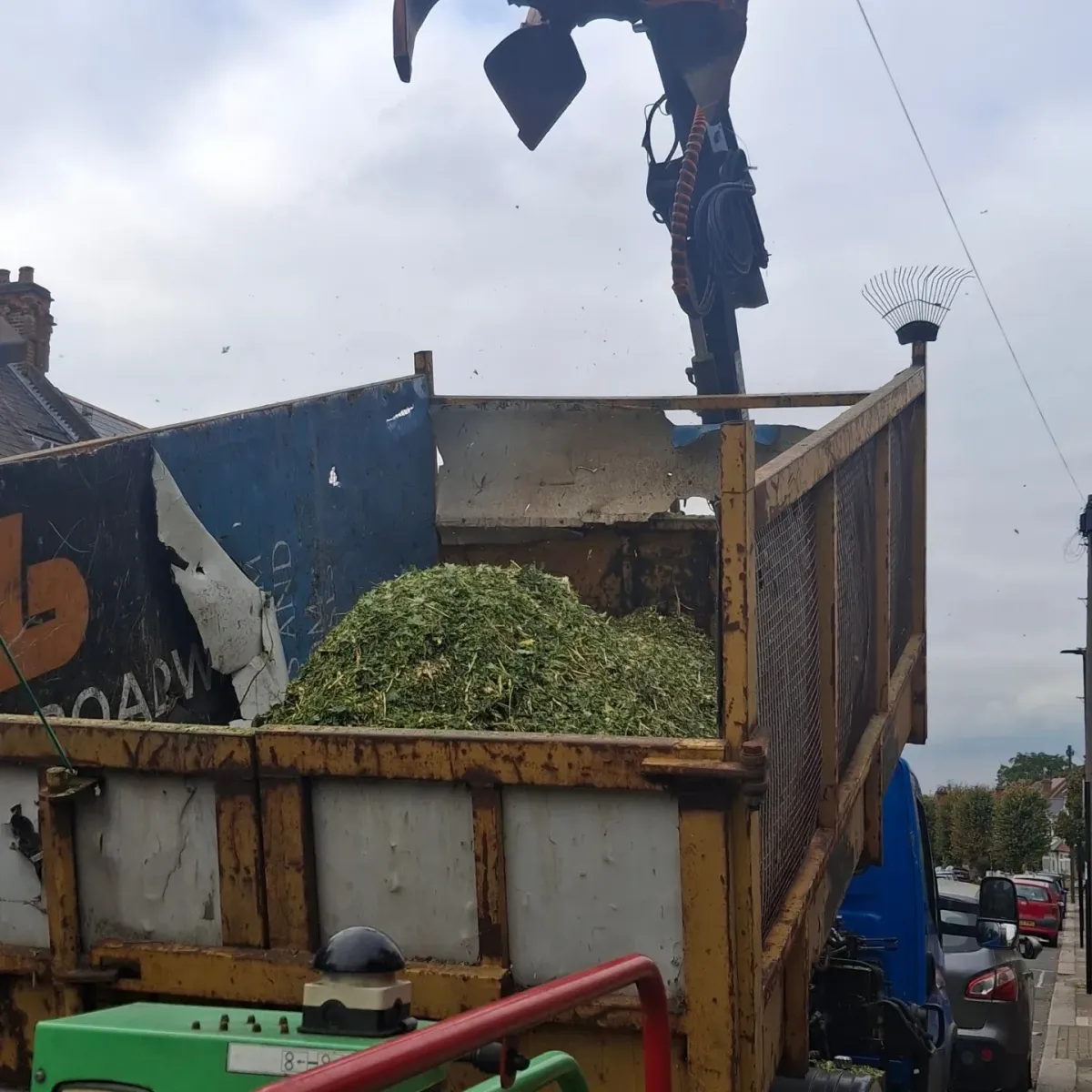 Woodchip loaded into a tipper lorry after tree cutting and chipping