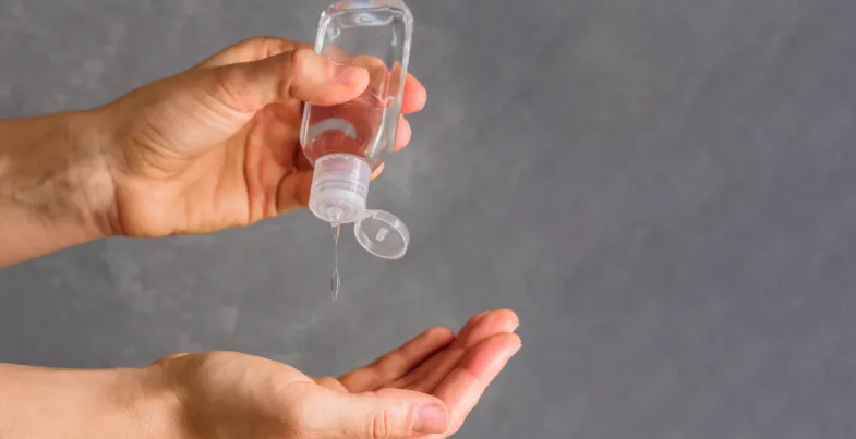hands and hand sanitizer