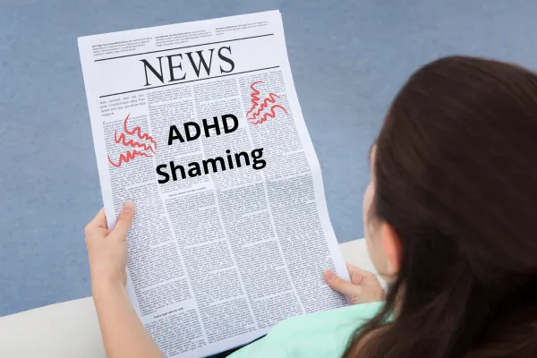 A lady reading a newspaper with the words ADHD Shaming on it.