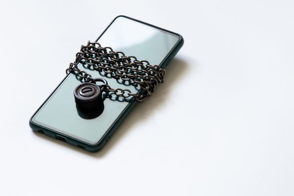 A smartphone wrapped in chains.