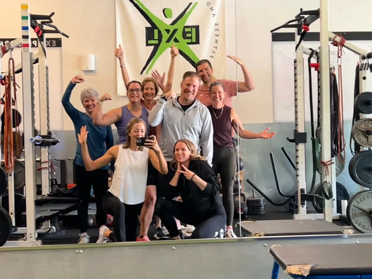 Person in grateful pose with heart symbol representing body gratitude and self-appreciation - EXL Fitness Orem Pleasant Grove