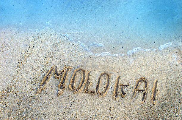 "molokai" written in the sand