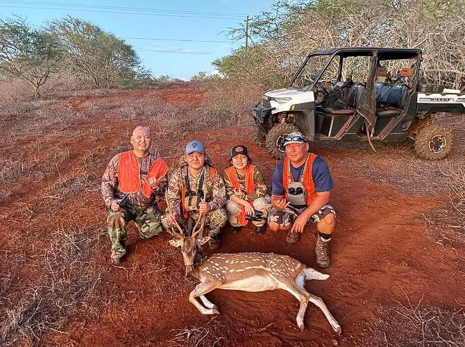 hunters with axis deer