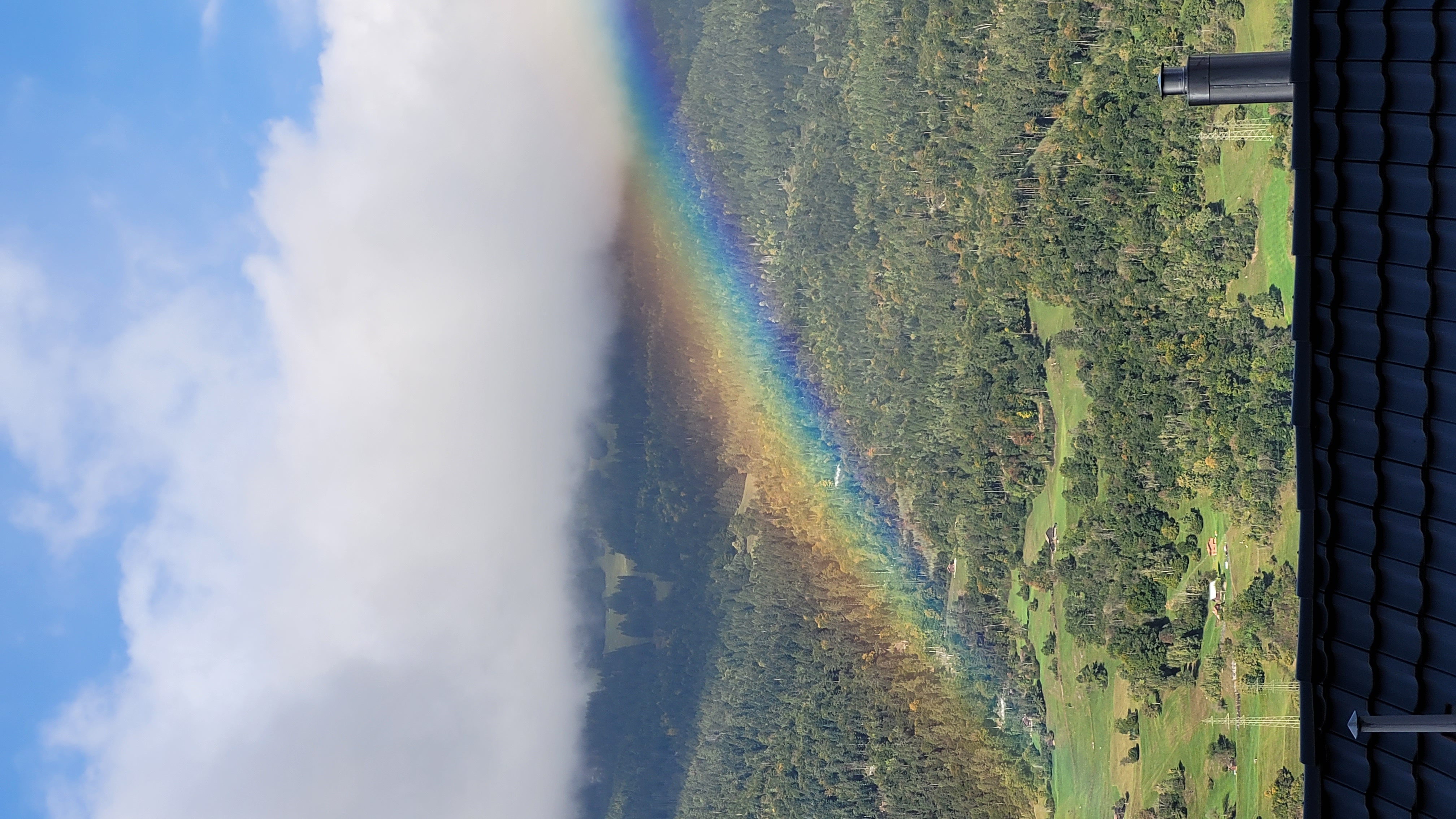 rainbow in the swiss alps