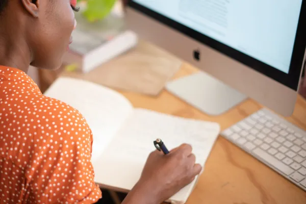 woman writes in a journal