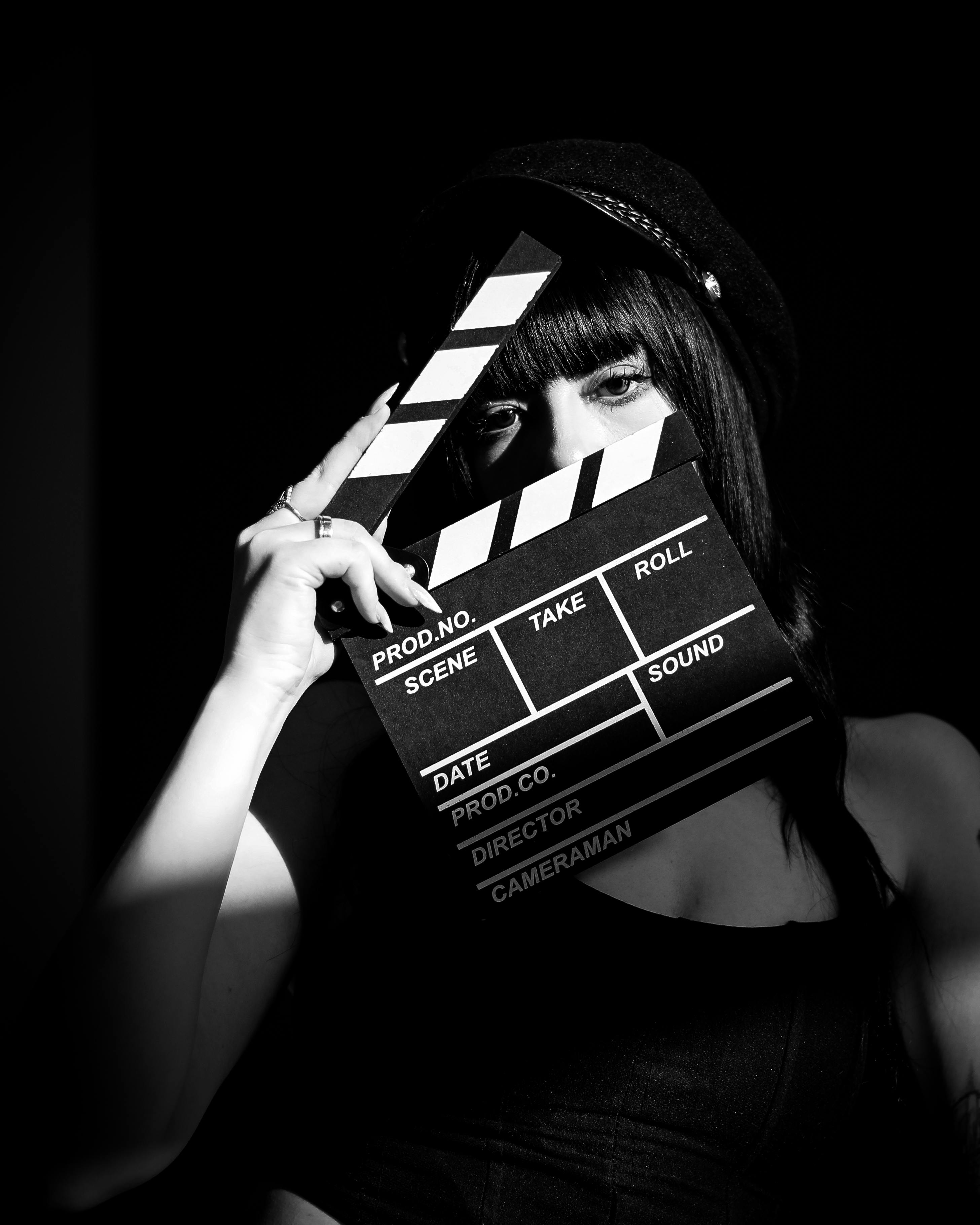 woman looking through clapboard