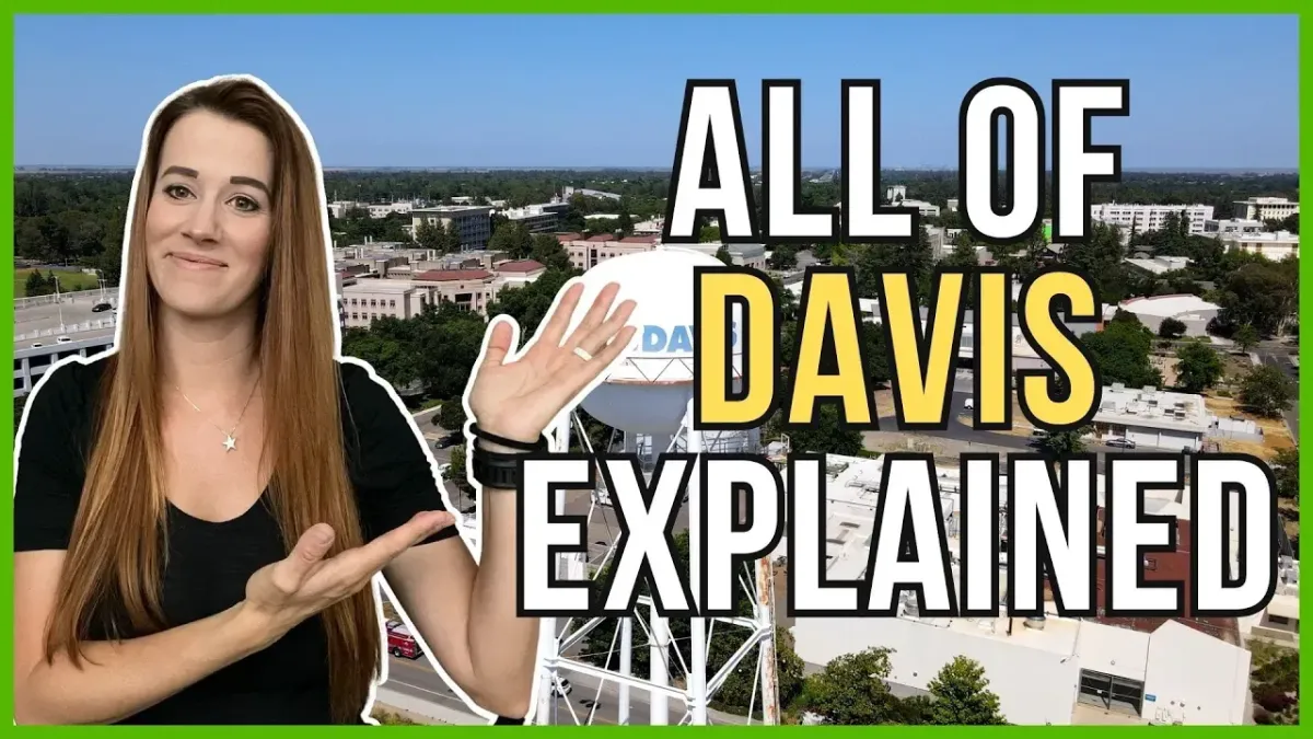 Lauren gestures to the words "ALL OF DAVIS EXPLAINED.”