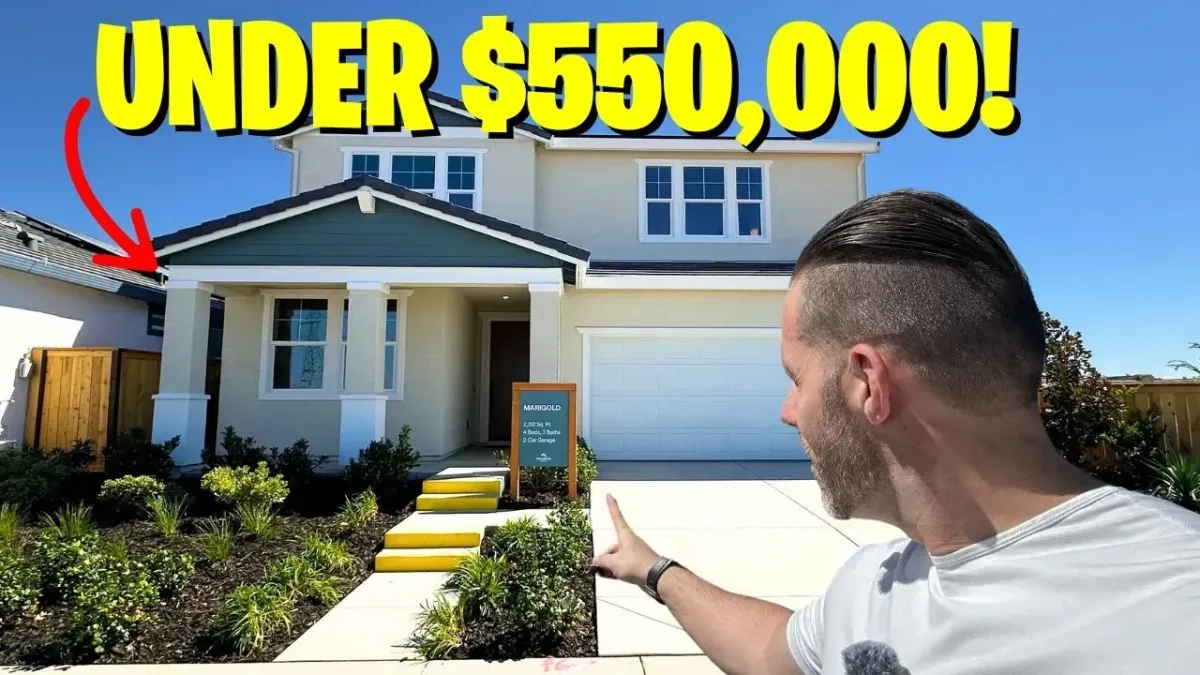 Lance pointing at the house.