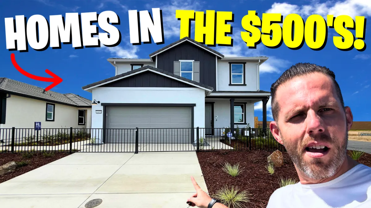 Lance in Front of a house pointing with text saying homes in the $500's!