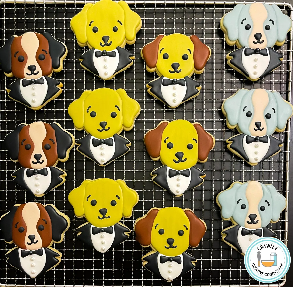 A delightful assortment of sugar cookies designed as dog princes dressed in tuxedos. Each cookie showcases a different dog breed, featuring detailed fur patterns, floppy ears, and regal touches like bow ties and buttons. The hand-iced designs are playful and elegant, capturing the charm of each dog in royal attire.