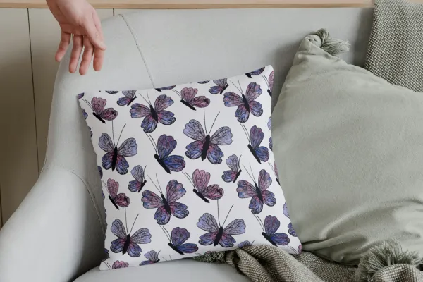 Pillow on couch with butterfly design