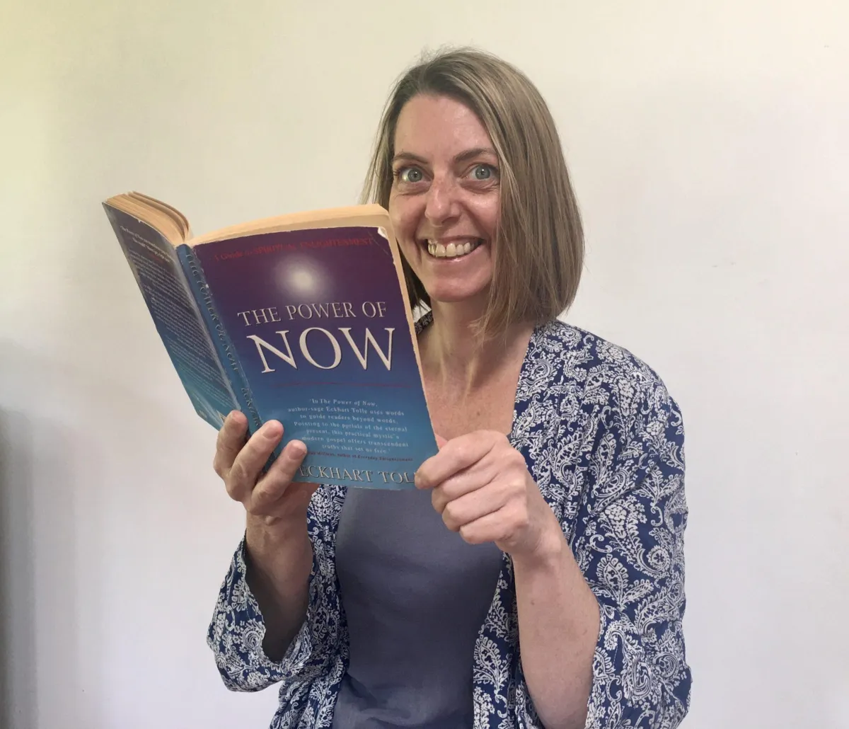 christine holding the book the power of now