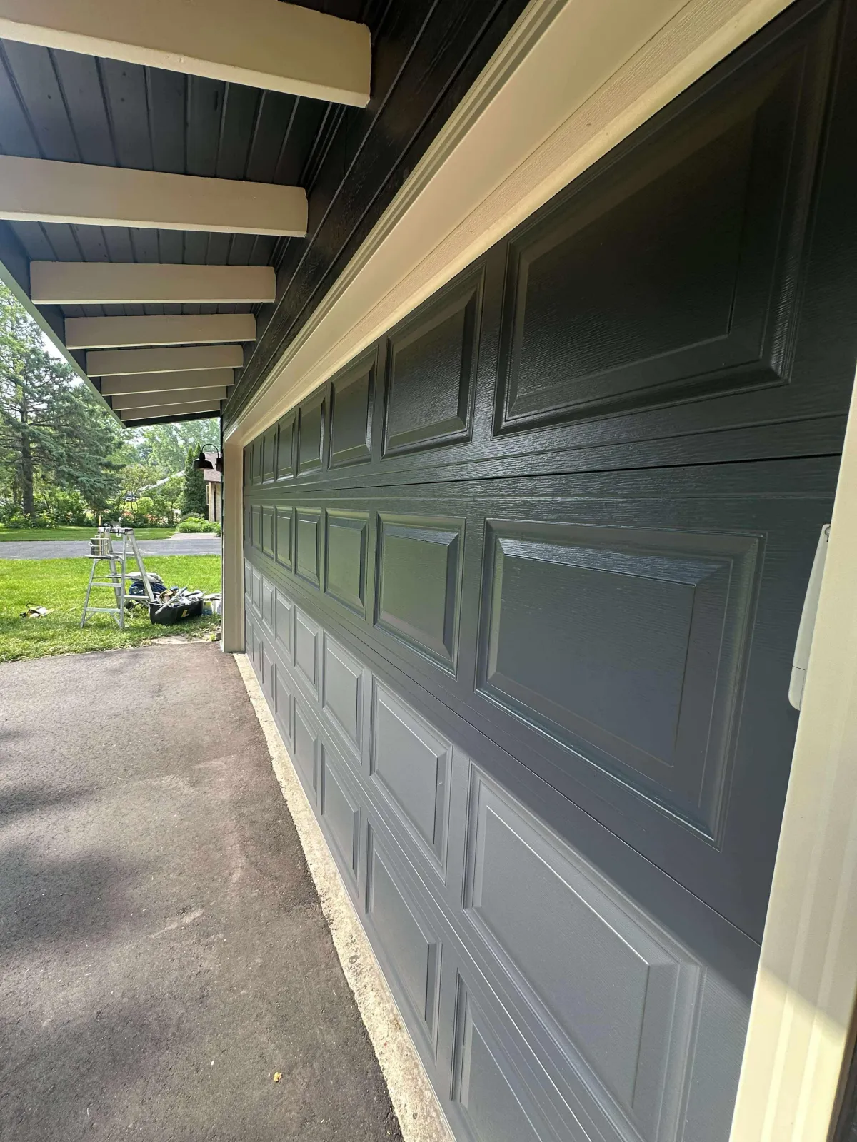 Dark gray freshly painted garage with a clean, modern finish