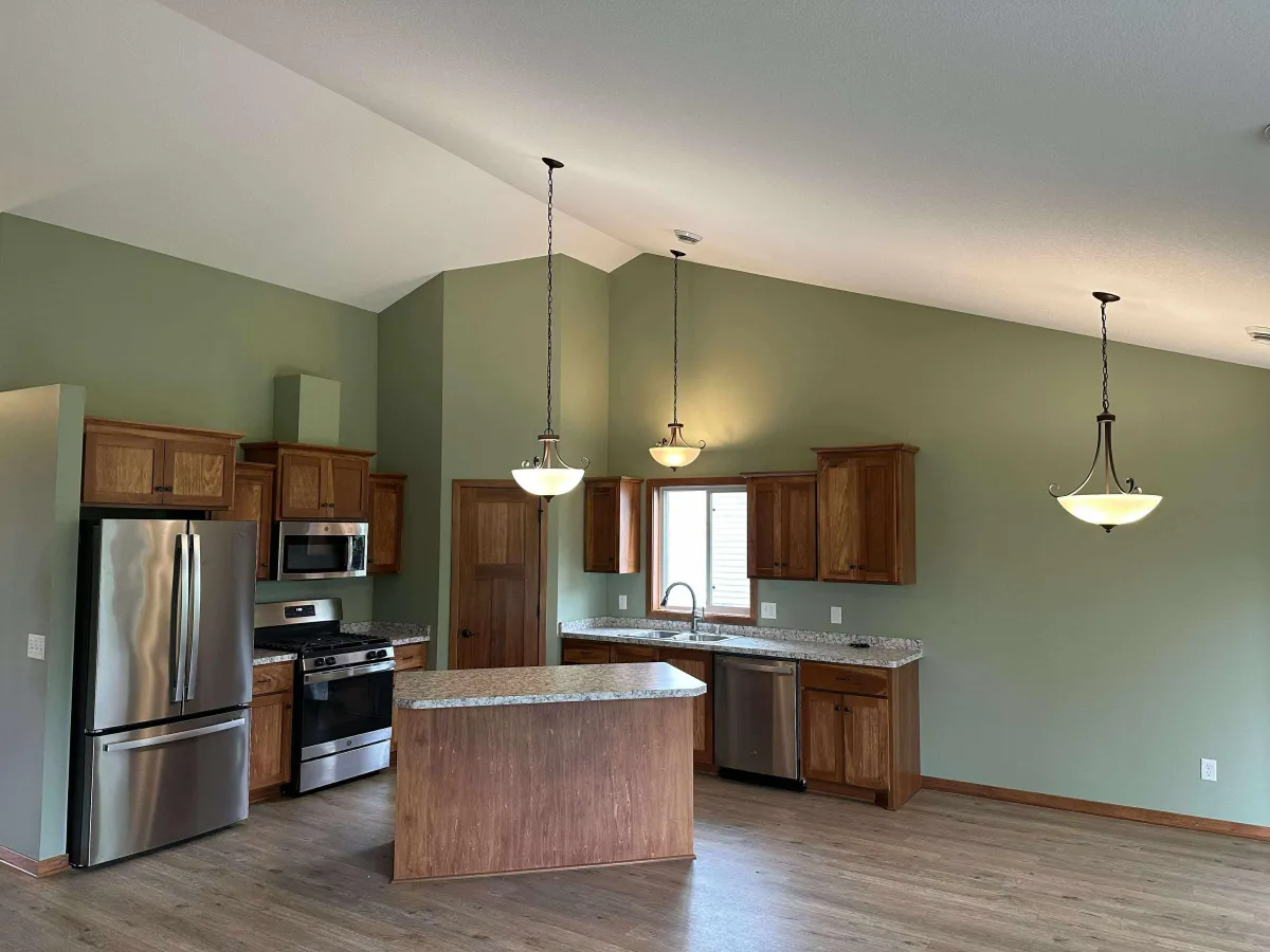 Kitchen with freshly painted olive green walls after interior repaint