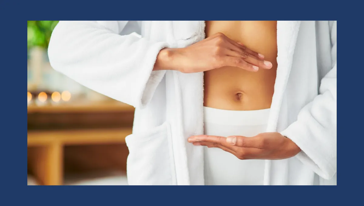 Woman showing her belly representing gut health