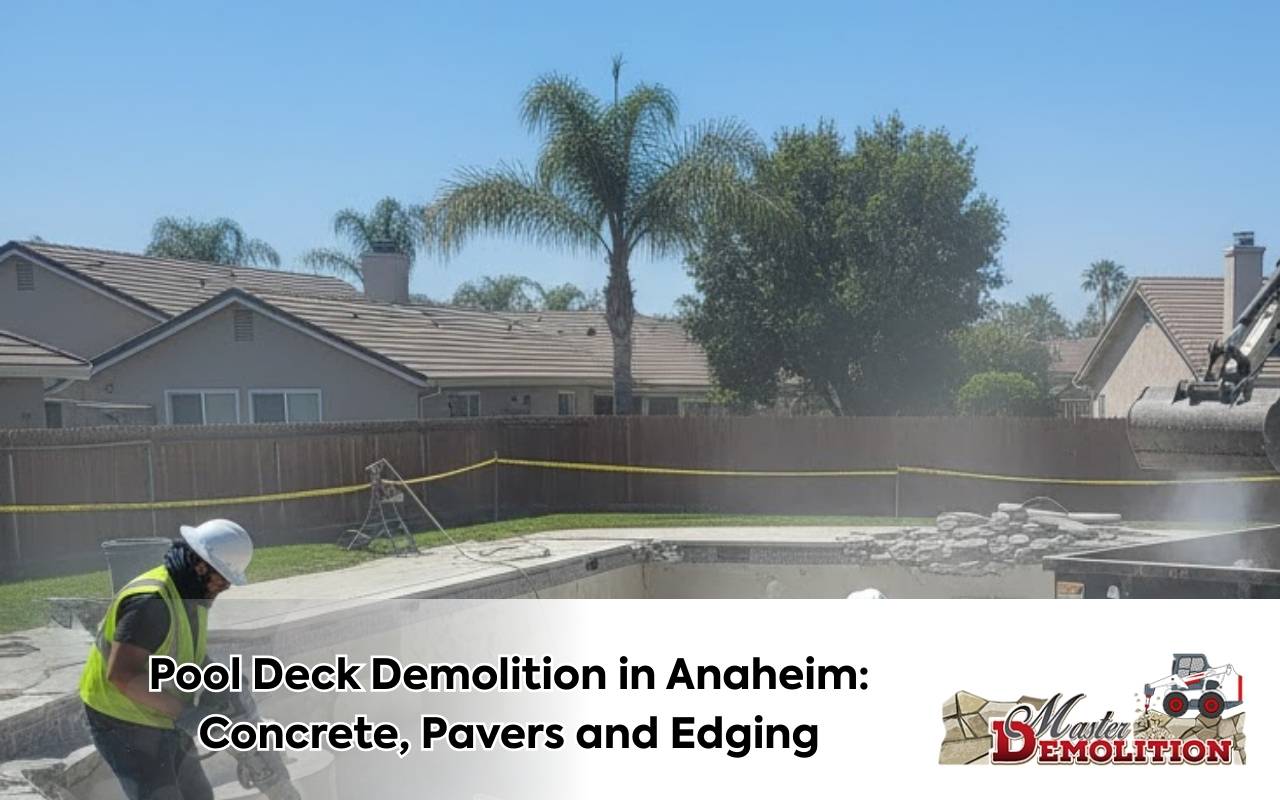 Contractor using saw cutting as one of the Pool Deck Demolition Options in Anaheim beside a modern swimming pool.