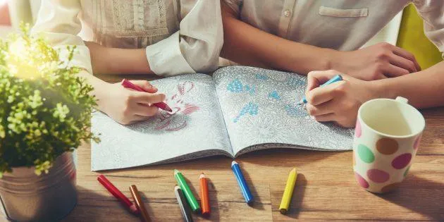 Two people colouring inin a book outside on a table. What is ADHD? Today, ADHD is viewed as a multifaceted condition triggered by varying behavioral, biological and environmental factors, including certain foods and food additives.