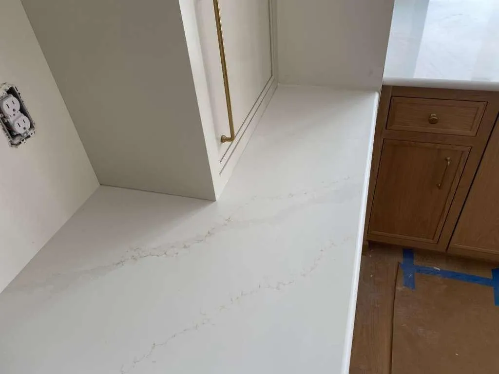 a custom Calacatta Telesto kitchen countertop installed by Quality First Granite