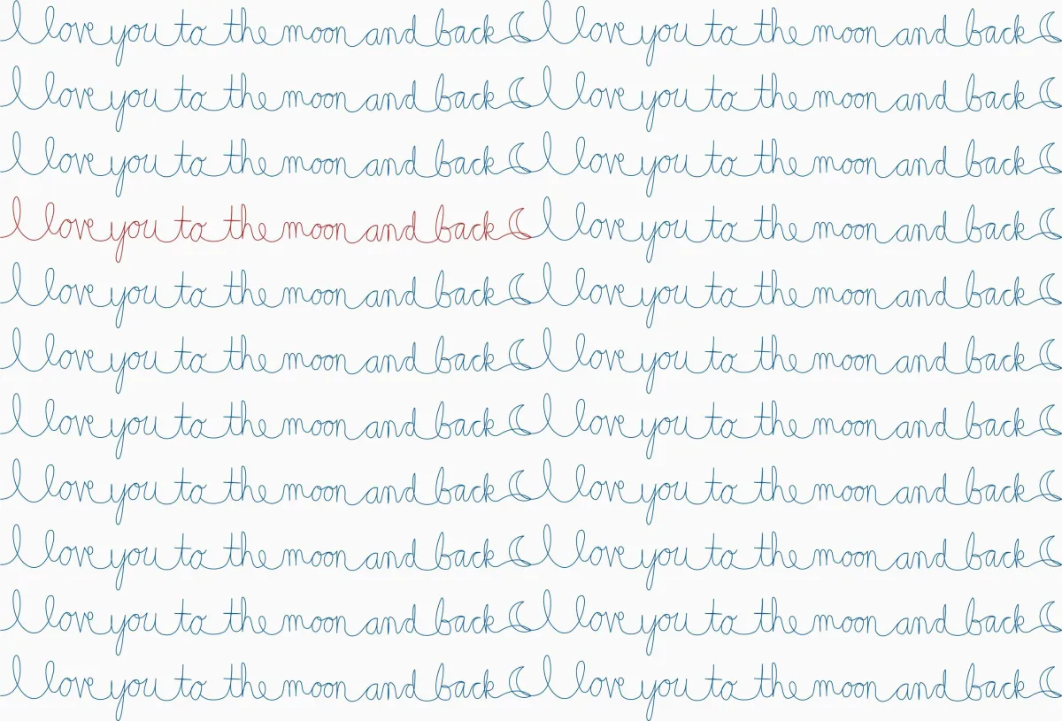 Whimsical quilting design of cursive writing reading "I love you to the moon and back"