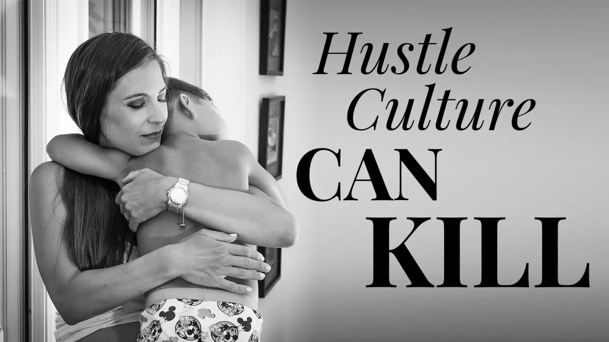 business mom hugging a child