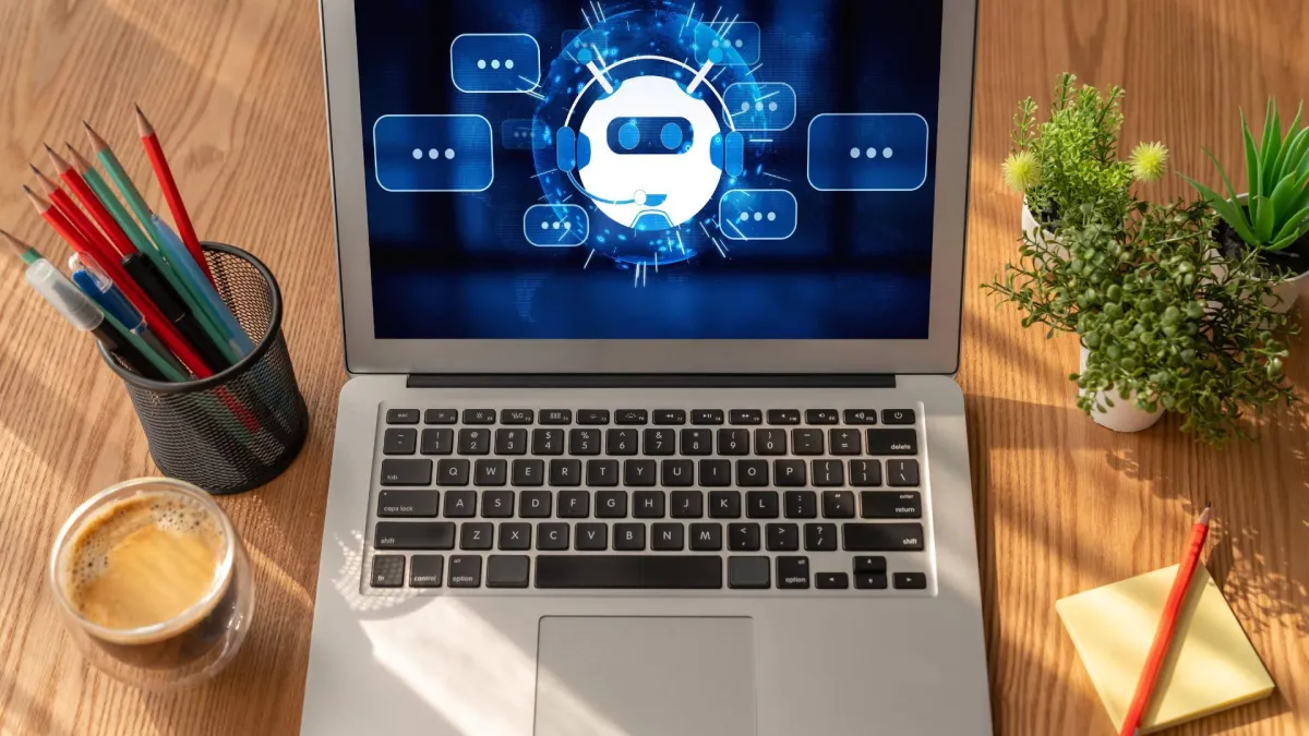 A laptop is displayed on a wooden desk, displayed a virtual screen demonstrating digital review capture solutions.