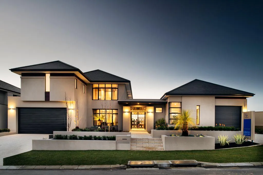 A happy couple standing in front of their newly purchased home in Adelaide.