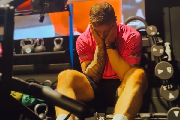 A dad exhausted in the gym