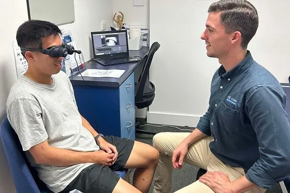 Physio working with client with vestibular goggles