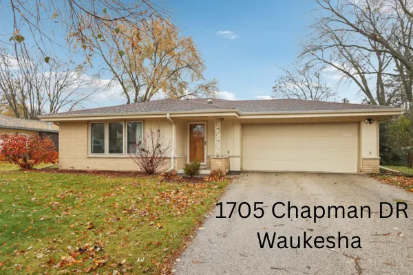 Chapman Drive Waukesha residential property with paved driveway and 2-car attached garage