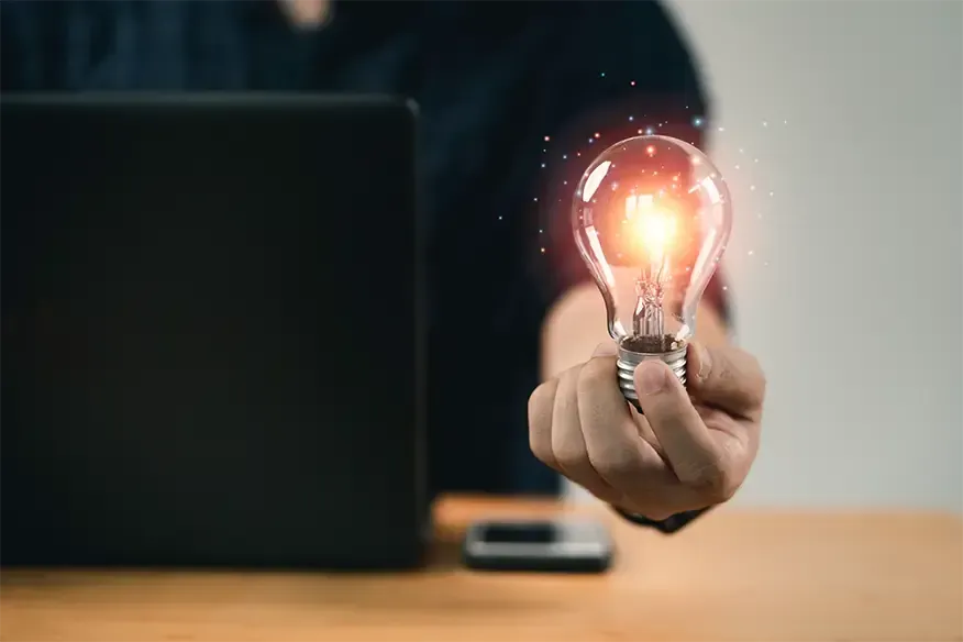 man holding a light bulb