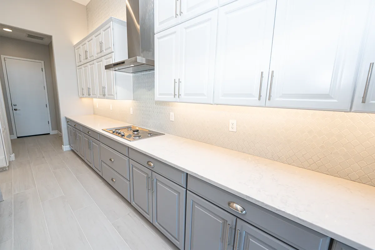 alt="Custom kitchen remodel in Tucson AZ with quartz countertops and modern cabinetry"