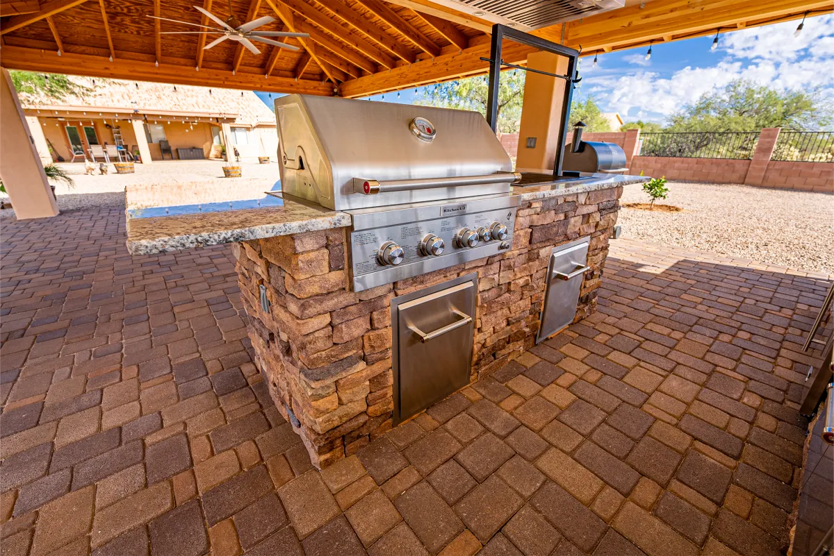 alt="Outdoor kitchen remodel and patio renovation in Tucson AZ designed for entertaining"