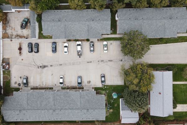 Top-down aerial view of commercial roofing system installed on multi-building property in Salt Lake City Utah