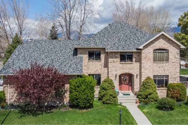 Highland Utah brick estate home with newly installed architectural shingle roofing system