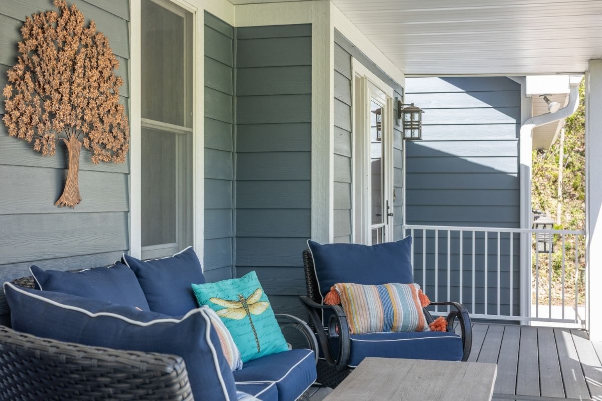 Light blue James Hardie fiber cement lap siding on a covered porch of a Utah residential home