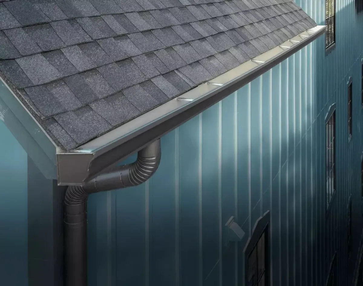 Seamless aluminum gutter installation on residential home in Alpine Utah for snow and rain drainage