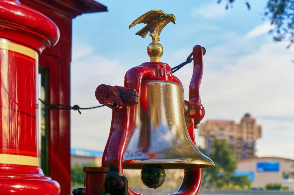 The Bell of the Earnest S Marsh Train at Disneyland With The Tower of Terror